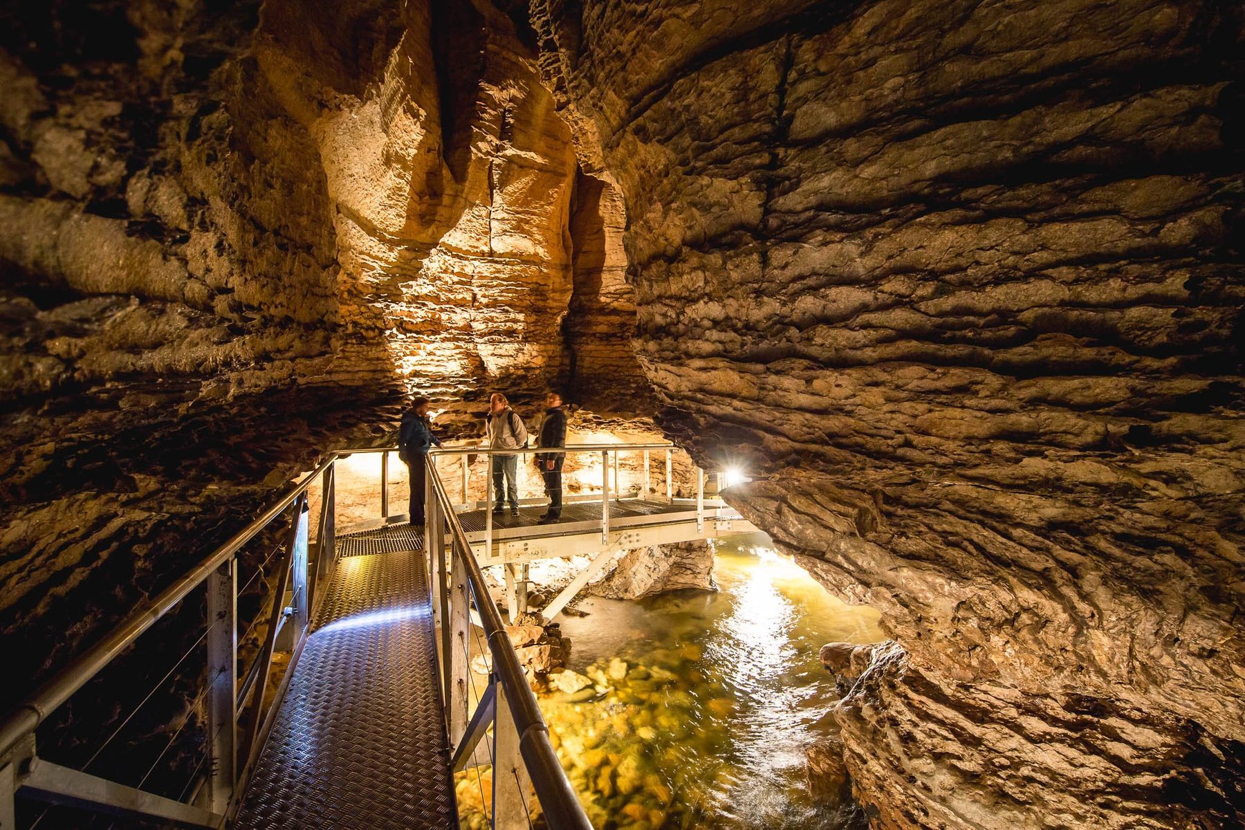 Raised walkway above the river inside the Te Anau cave